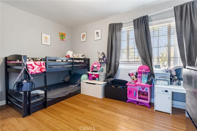 bedroom featuring light wood finished floors