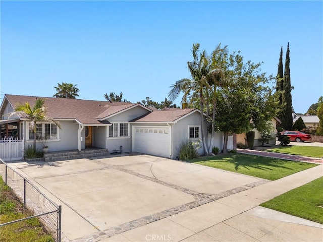 ranch-style house with an attached garage, fence, concrete driveway, a front lawn, and stucco siding