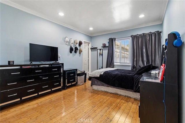bedroom with recessed lighting, light wood finished floors, and ornamental molding