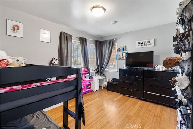 bedroom with wood finished floors
