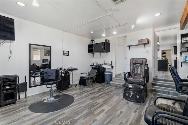 miscellaneous room with wood finished floors
