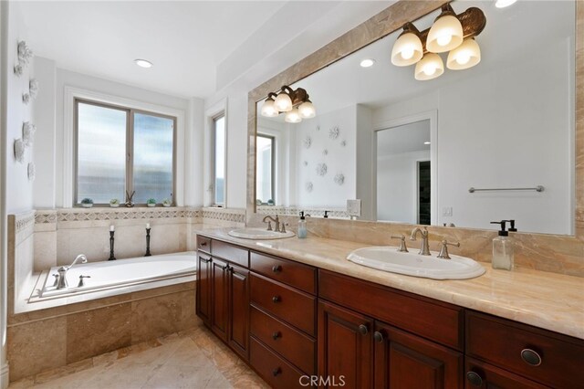 619 10th St, Hermosa Beach, CA 90254 - bathroom with a sink, double vanity, recessed lighting, and a garden tub