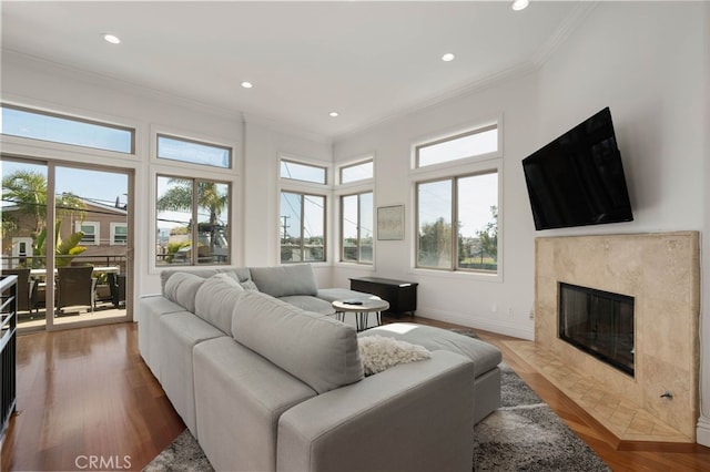 619 10th St, Hermosa Beach, CA 90254 - living room featuring a premium fireplace, crown molding, baseboards, and recessed lighting