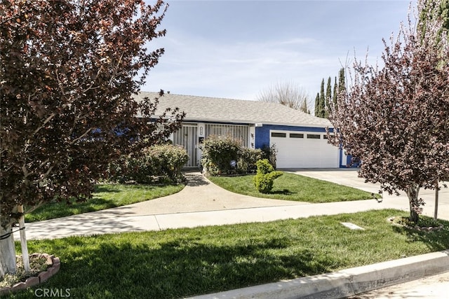 610 Woodington Dr, Lancaster, CA 93535 - ranch-style house featuring an attached garage, concrete driveway, a front yard, and roof with shingles