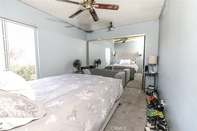 610 Woodington Dr, Lancaster, CA 93535 - carpeted bedroom featuring a closet, a textured ceiling, and ceiling fan