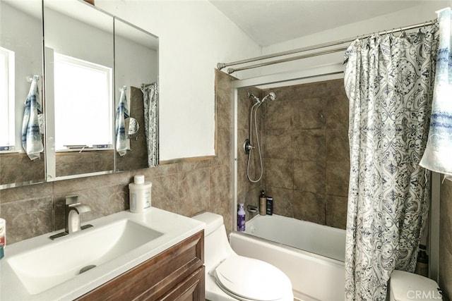 610 Woodington Dr, Lancaster, CA 93535 - full bathroom with toilet, tile walls, shower / tub combo, and vanity