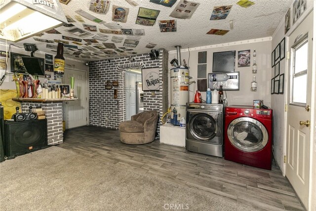 610 Woodington Dr, Lancaster, CA 93535 - washroom with independent washer and dryer, water heater, wood finished floors, and brick wall