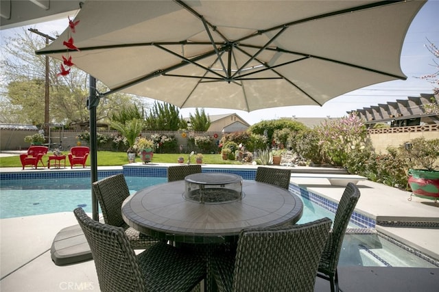 610 Woodington Dr, Lancaster, CA 93535 - view of patio featuring a fenced backyard, an outdoor pool, and outdoor dining area