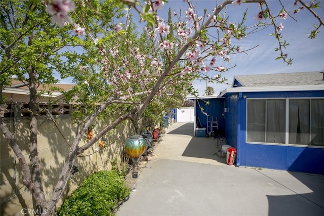 610 Woodington Dr, Lancaster, CA 93535 - view of property exterior with a patio and fence
