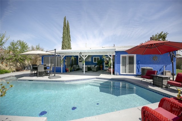 610 Woodington Dr, Lancaster, CA 93535 - view of swimming pool featuring outdoor lounge area, a patio, cooling unit, and outdoor dining space