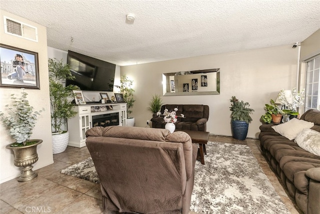 610 Woodington Dr, Lancaster, CA 93535 - tiled living room with a textured ceiling