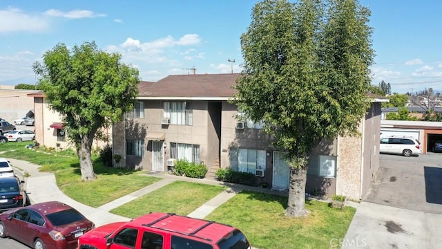 1616 Picadilly Way, Fullerton, CA 92833 - view of front of house with a front yard, stucco siding, and uncovered parking