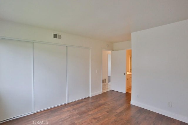 1616 Picadilly Way, Fullerton, CA 92833 - unfurnished bedroom with a closet, dark wood finished floors, and baseboards