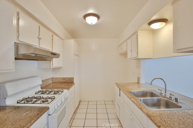 1616 Picadilly Way, Fullerton, CA 92833 - kitchen featuring under cabinet range hood, white gas range, a sink, light tile patterned floors, and white cabinetry