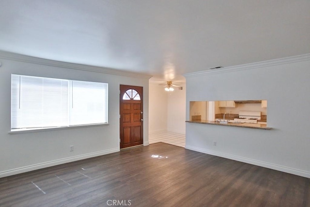 1616 Picadilly Way, Fullerton, CA 92833 - entryway with crown molding, wood finished floors, ceiling fan, and baseboards