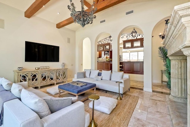 11558 Creek Rd, Poway, CA 92064 - living area with arched walkways, a chandelier, beam ceiling, and a towering ceiling