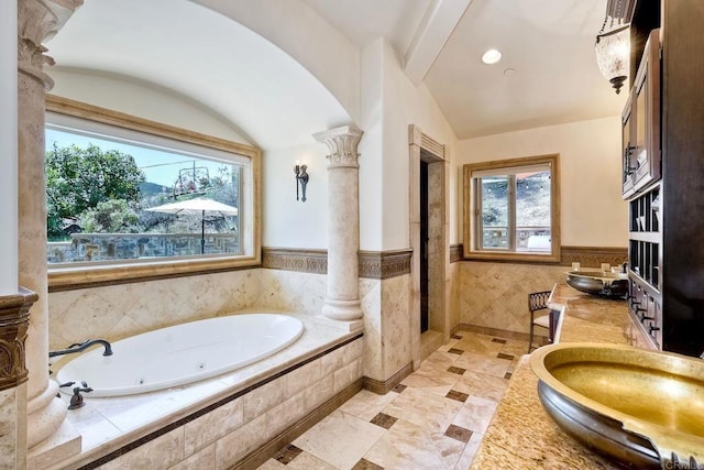 11558 Creek Rd, Poway, CA 92064 - full bath with plenty of natural light, a wainscoted wall, a whirlpool tub, tile walls, and decorative columns