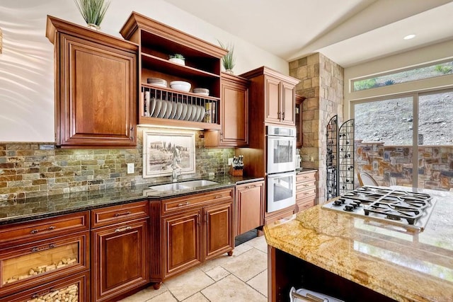 11558 Creek Rd, Poway, CA 92064 - kitchen with stainless steel double oven, dark stone counters, open shelves, tasteful backsplash, and gas stovetop