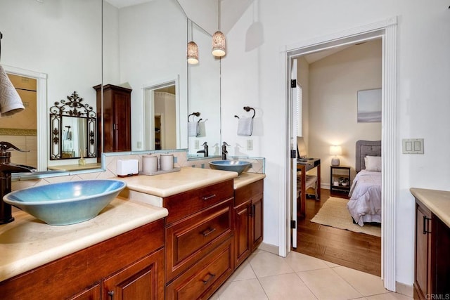 11558 Creek Rd, Poway, CA 92064 - ensuite bathroom featuring vanity, tile patterned flooring, a high ceiling, and tasteful backsplash