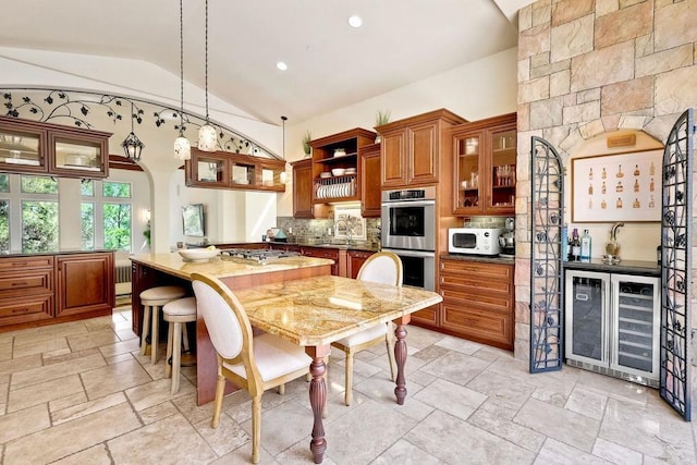 11558 Creek Rd, Poway, CA 92064 - kitchen featuring beverage cooler, stainless steel appliances, brown cabinets, lofted ceiling, and backsplash