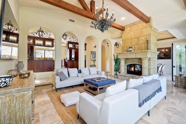 11558 Creek Rd, Poway, CA 92064 - living area with a chandelier, healthy amount of natural light, beam ceiling, high vaulted ceiling, and a tile fireplace