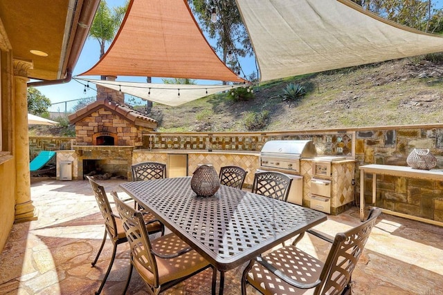 11558 Creek Rd, Poway, CA 92064 - view of patio / terrace featuring exterior fireplace, exterior kitchen, and outdoor dining area