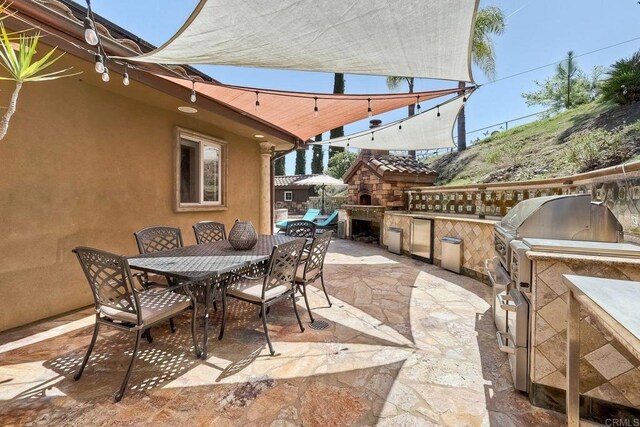 11558 Creek Rd, Poway, CA 92064 - view of patio with outdoor dining space and an outdoor kitchen