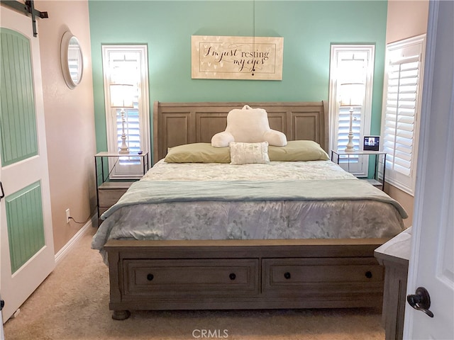 23796 Corte Picante, Murrieta, CA 92562 - carpeted bedroom with baseboards, multiple windows, and a barn door
