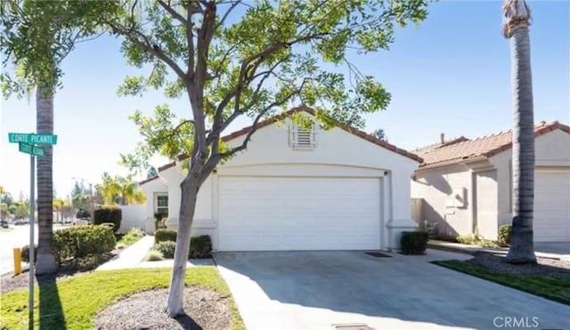 23796 Corte Picante, Murrieta, CA 92562 - view of front of home with an attached garage, driveway, and stucco siding