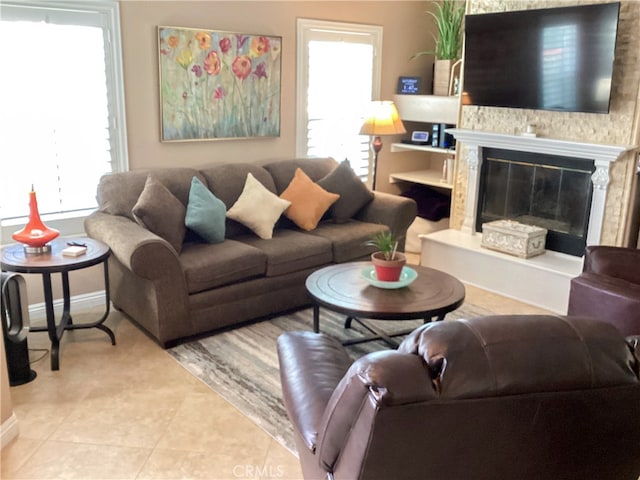 23796 Corte Picante, Murrieta, CA 92562 - tiled living area featuring baseboards and a glass covered fireplace