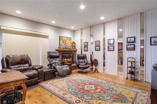 7191 Slater Ave, Huntington Beach, CA 92647 - living area featuring recessed lighting, a glass covered fireplace, and wood finished floors