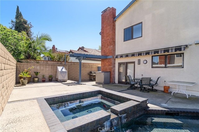 7191 Slater Ave, Huntington Beach, CA 92647 - view of pool featuring a pool with connected hot tub, a grill, a fenced backyard, a patio area, and outdoor dining space