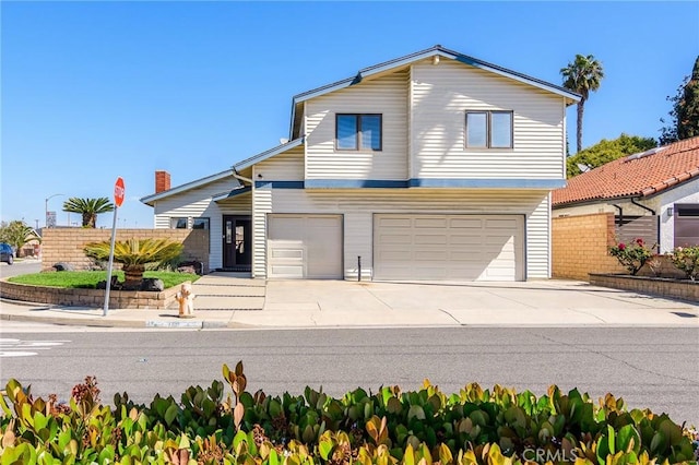 7191 Slater Ave, Huntington Beach, CA 92647 - traditional-style house featuring an attached garage and driveway