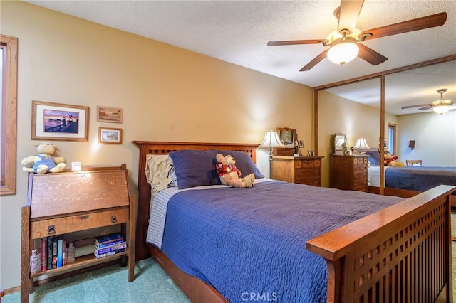 7191 Slater Ave, Huntington Beach, CA 92647 - carpeted bedroom with a ceiling fan and a textured ceiling
