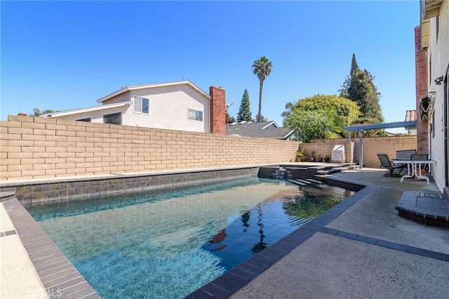 7191 Slater Ave, Huntington Beach, CA 92647 - view of swimming pool with a patio, a pool with connected hot tub, and a fenced backyard