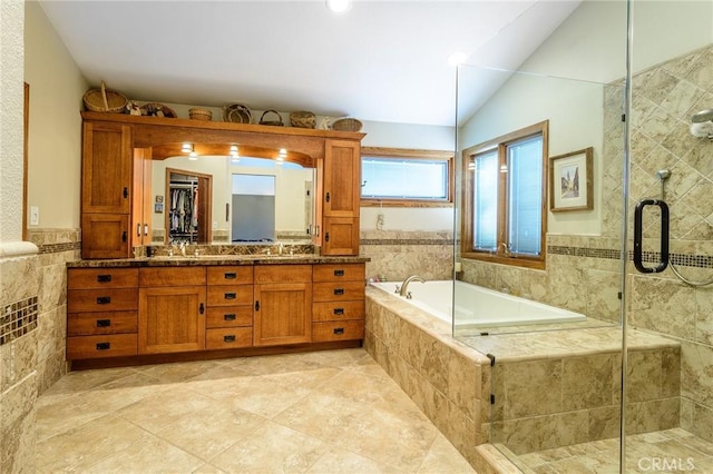 7191 Slater Ave, Huntington Beach, CA 92647 - full bathroom featuring double vanity, a garden tub, tile patterned flooring, a stall shower, and lofted ceiling