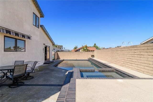 7191 Slater Ave, Huntington Beach, CA 92647 - view of swimming pool featuring a fenced in pool, a patio area, and a fenced backyard