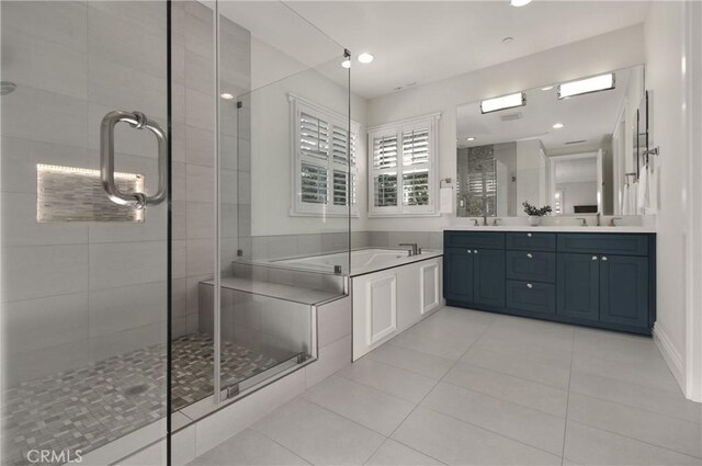 bathroom with a shower stall, a bath, tile patterned flooring, and double vanity