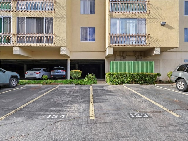 12720 Burbank Blvd Unit 323, Valley Village, CA 91607 - view of building exterior featuring parking