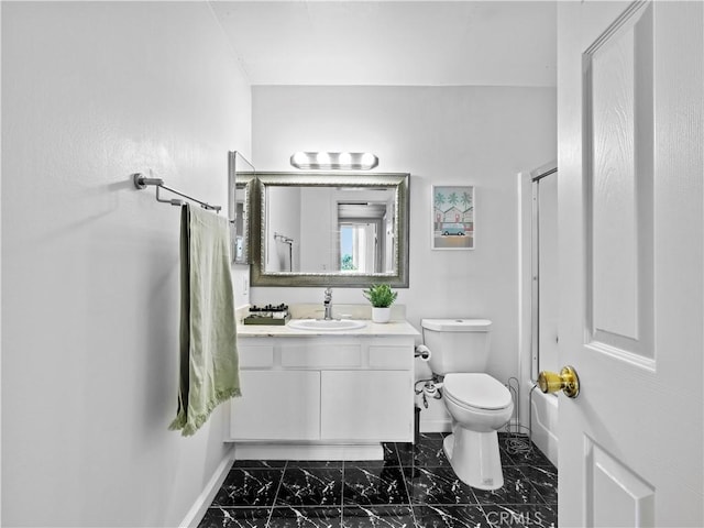 12720 Burbank Blvd Unit 323, Valley Village, CA 91607 - full bathroom featuring baseboards, vanity, marble finish flooring, toilet, and a shower