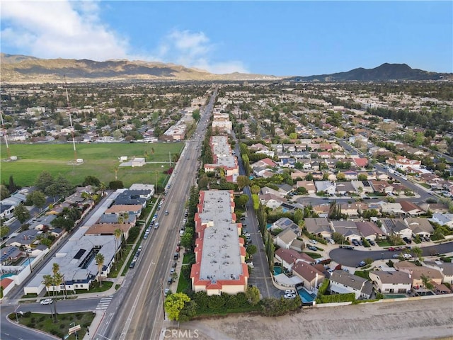 12720 Burbank Blvd Unit 323, Valley Village, CA 91607 - aerial overview of property's location with a mountainous background and nearby suburban area