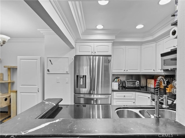 12720 Burbank Blvd Unit 323, Valley Village, CA 91607 - kitchen with appliances with stainless steel finishes, crown molding, white cabinetry, dark stone countertops, and recessed lighting