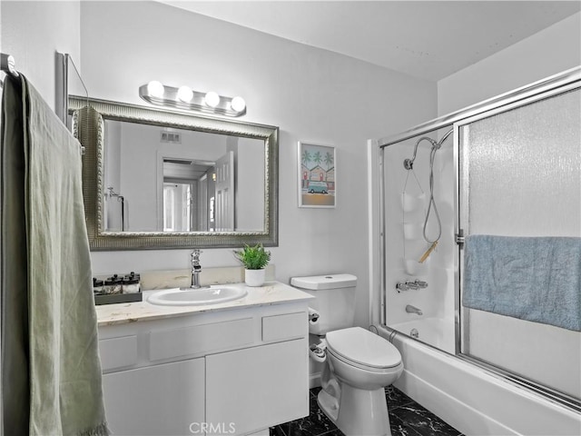 12720 Burbank Blvd Unit 323, Valley Village, CA 91607 - full bath featuring marble finish flooring, vanity, enclosed tub / shower combo, and toilet