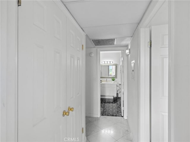12720 Burbank Blvd Unit 323, Valley Village, CA 91607 - hallway with baseboards and a sink