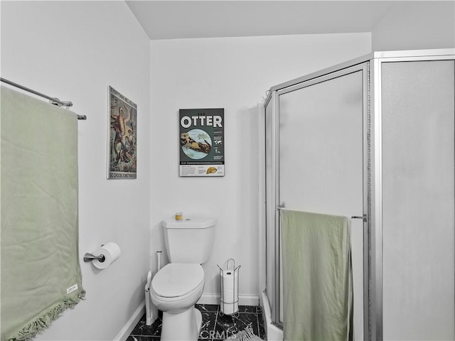 12720 Burbank Blvd Unit 323, Valley Village, CA 91607 - full bath with marble look tiles, baseboards, a stall shower, and toilet