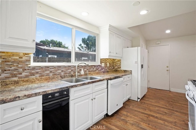 kitchen featuring tasteful backsplash, dark wood-style flooring, white appliances, white cabinetry, and a sink