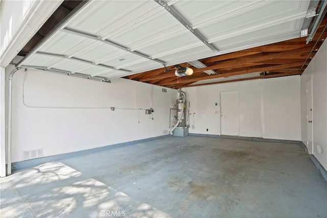 garage featuring visible vents and a garage door opener