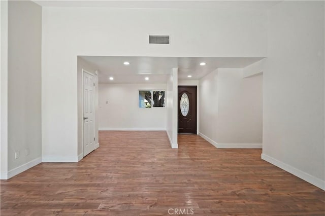 entrance foyer with wood finished floors, baseboards, visible vents, and recessed lighting