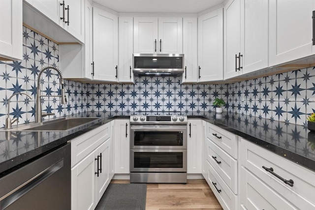 3421 Park Blvd Unit 401, San Diego, CA 92103 - kitchen featuring appliances with stainless steel finishes, a sink, and white cabinets