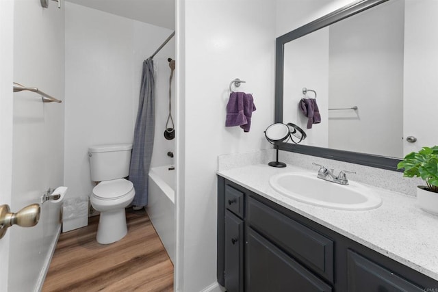 3421 Park Blvd Unit 401, San Diego, CA 92103 - bathroom featuring toilet, vanity, shower / bath combo with shower curtain, wood finished floors, and baseboards